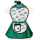 A green and white apron with a butterfly print on the bib section, displayed on a mannequin torso with white puffed sleeves against a white background.